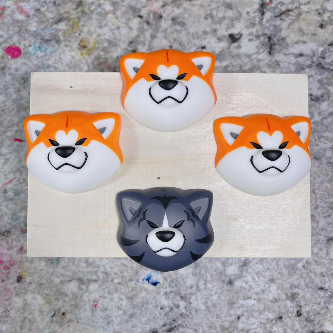 Japanese Akita magnets, hand sculpted, casted, and painted by Rio.